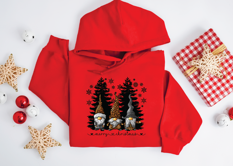 Gnomes "Merry Christmas" sweatshirt featuring adorable gnomes and silhouetted Christmas trees, perfect for celebrating the holiday season with a whimsical touch.