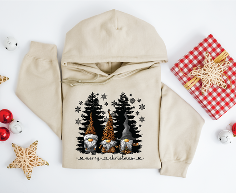 Gnomes "Merry Christmas" sweatshirt featuring adorable gnomes and silhouetted Christmas trees, perfect for celebrating the holiday season with a whimsical touch.