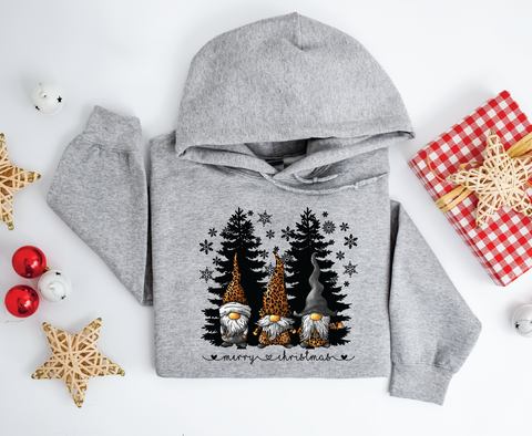 Gnomes "Merry Christmas" sweatshirt featuring adorable gnomes and silhouetted Christmas trees, perfect for celebrating the holiday season with a whimsical touch.