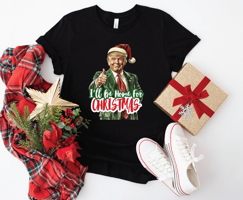 Trump "I'll Be Home for Christmas" softstyle shirt featuring a humorous design, perfect for celebrating the holiday season with a playful touch.